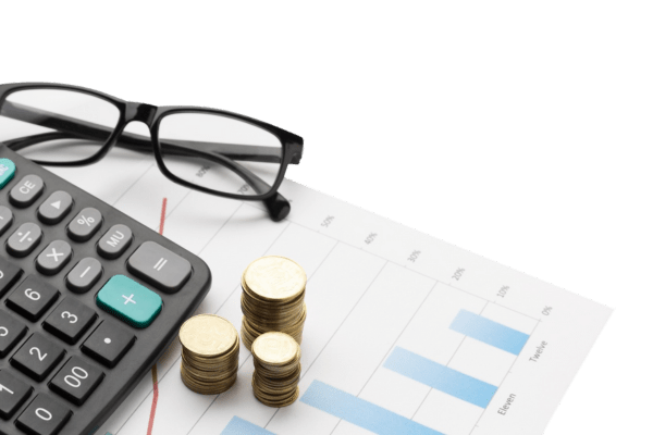 Budget-image-tr calculator, charts on paper, folded glasses, stack of gold coins